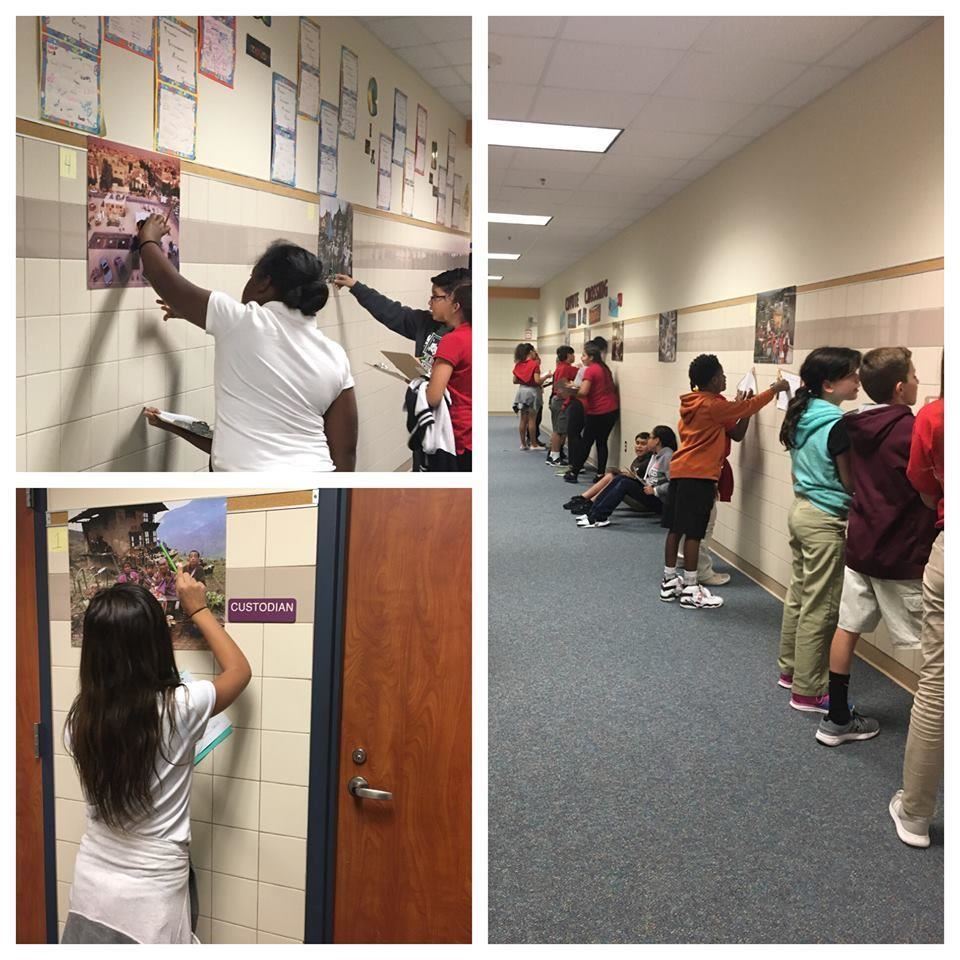 Students practicing social studies on the wall.